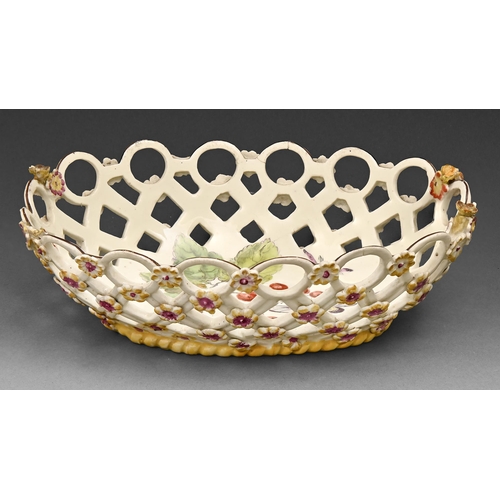 518 - A Derby 'spectacle' basket, c1760, sprigged with yellow florets above yellow enamel rope footrim, en... 