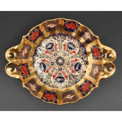 533 - A Royal Crown Derby Imari pattern dish with pierced handles and foot, late 20th c, 16.5cm l, printed... 