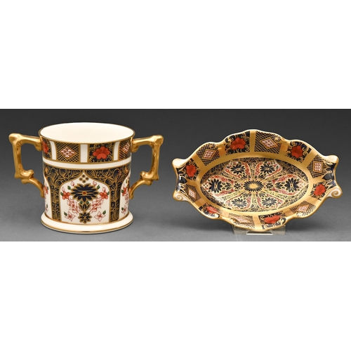 535 - A Royal Crown Derby Imari pattern loving cup and pin tray, late 20th c, loving cup 76mm h, printed m... 