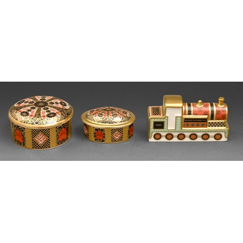 538 - Two Royal Crown Derby Imari pattern boxes and covers and a locomotive paperweight, early 21st c, loc... 