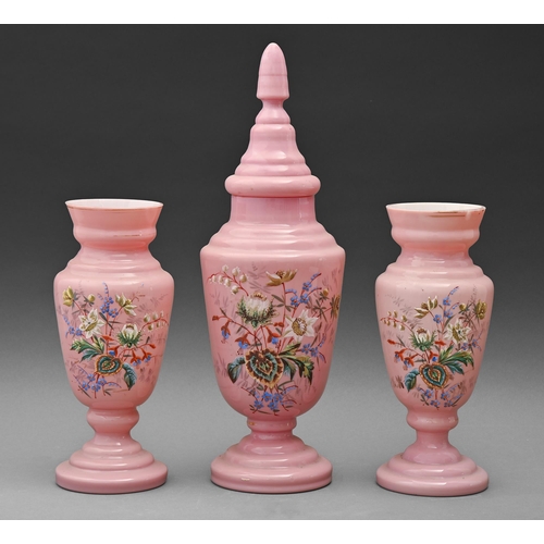 591 - A Victorian pink glass garniture, painted with flowers, vase and cover 42cm h (4)