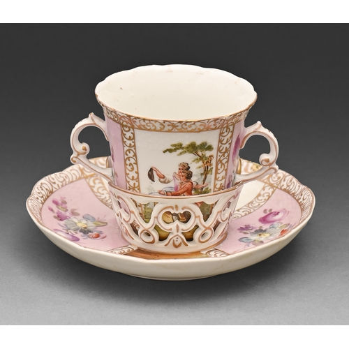 615 - A German porcelain two handled cup and trembleuse stand, c1900, painted with 18th c lovers alternati... 