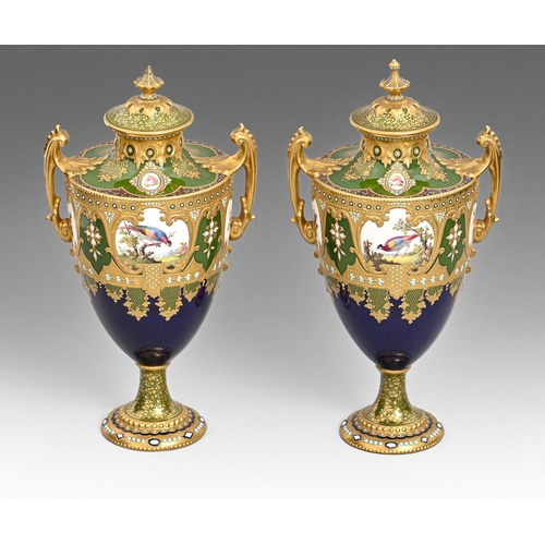 636 - A pair of Royal Crown Derby vases and covers, 1907,  of shield shape, painted by Leroy, signed, with... 