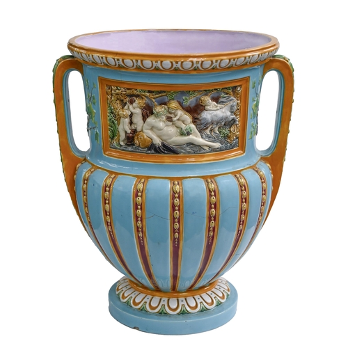 639 - A Minton majolica vase, 1870, moulded in high relief to each side with a panel of centaurs or Bacchu... 