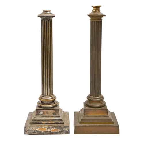 710 - Two similar Edwardian brass or plated columnar oil lamps, the reeded shaft on stepped square foot, 4... 