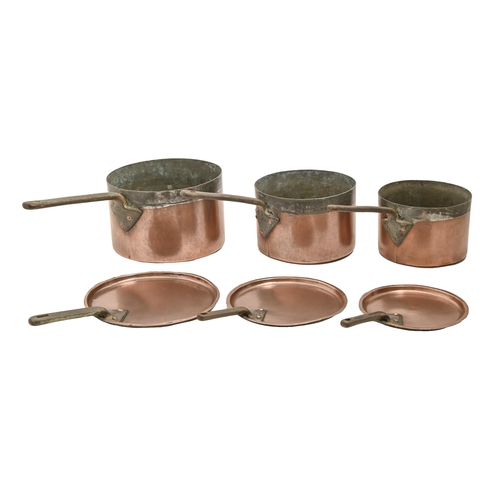 721 - Three graduated Victorian or Edwardian copper saucepans, with iron handle, seamed, 23cm diam and sma... 