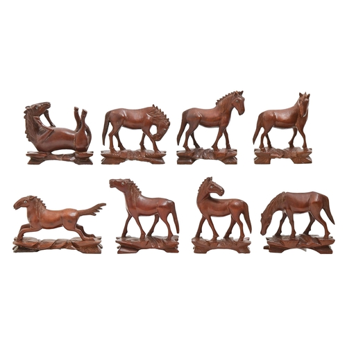 764 - A set of eight Chinese stained and carved wood horses of Mu Wang, 20th c, 80mm h