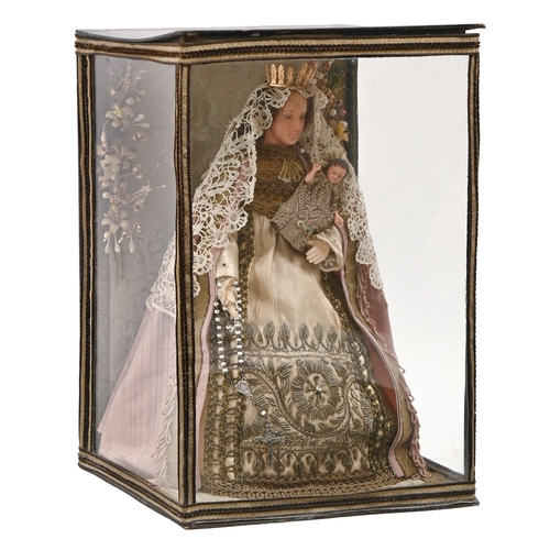 776 - An Italian Blessed Virgin Mary doll with the Christ Child, 19th / 20th c, having wax head and hands,... 