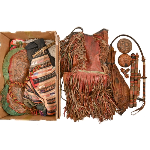 816 - Ethnographica. A North African leather handled camel whip, a deeply fringed red leather water bag, a... 