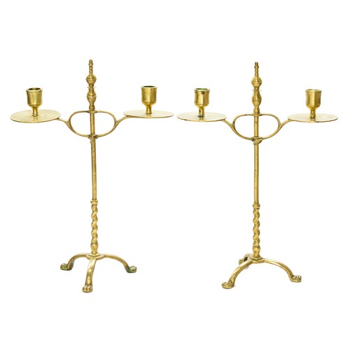 725A - A pair of English brass adjustable candelabra, c1900,  on domed tripod, 38cm h