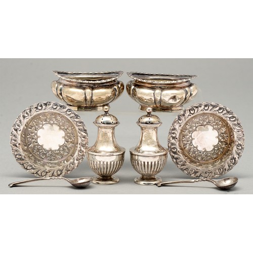 295 - A pair of Victorian silver vase shaped pepperettes, crested, 62mm h, by Henry Matthews, Birmingham 1... 