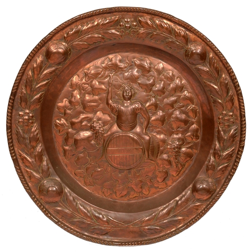 115 - A copper plaque, early 20th c, 46cm diam