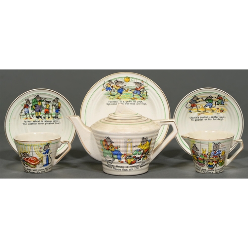 41 - A 1930s earthenware child's  tea service, decorated with mice, teapot 10cm h (21)