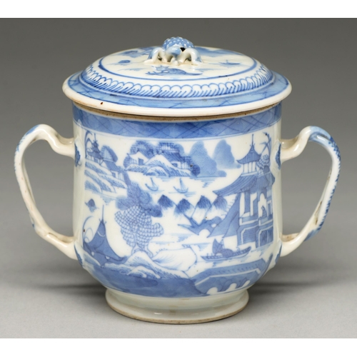 110 - A Chinese blue and white two handled cup and cover, early 19th c, with entwined handles, painted to ... 