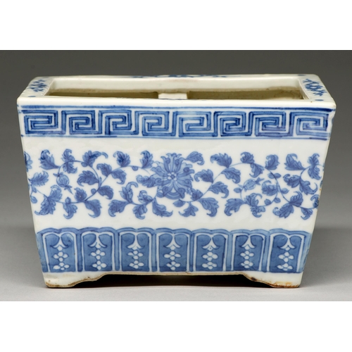 112 - A Chinese blue and white jardiniere, late 19th / early 20th c, painted with lotus meander between fr... 