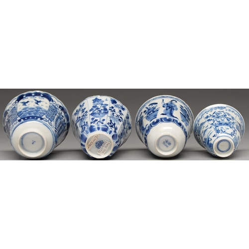 116 - A Chinese blue and white octagonal beaker, Kangxi period, painted in upright registers with flowerin... 