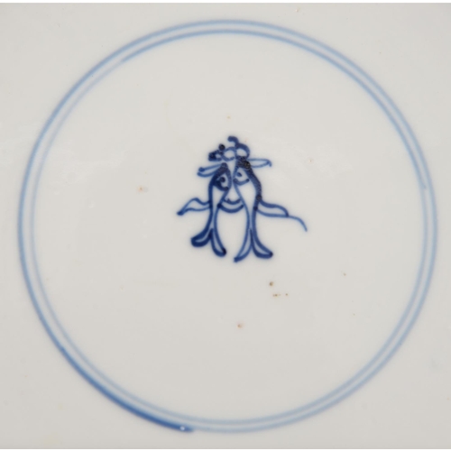 129 - Two graduated Chinese blue and white plates, 18th c, painted with dragon and carp rising from surgin... 