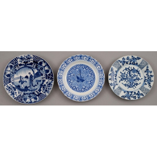 130 - Three Chinese blue and white plates, Kangxi period, painted with a lady and jumping boy or other des... 