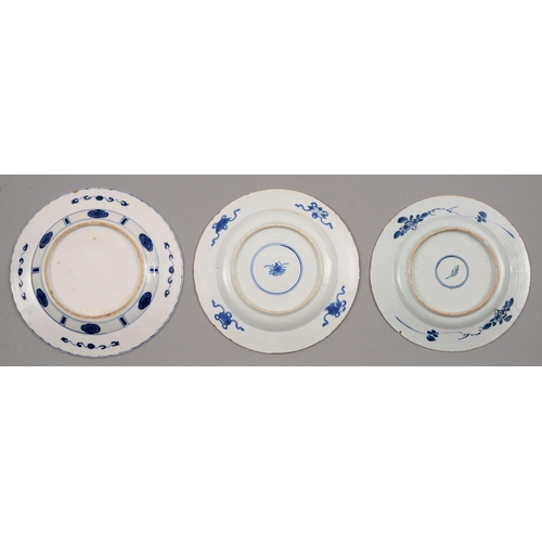 130 - Three Chinese blue and white plates, Kangxi period, painted with a lady and jumping boy or other des... 