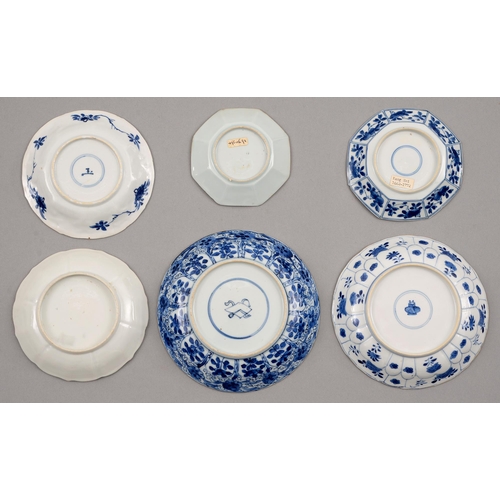 132 - Six Chinese blue and white saucers, Kangxi period, one petal-moulded, each painted with a different ... 