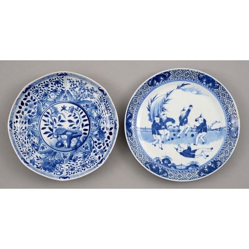 134 - Two Chinese blue and white plates, 18th and 19th c, painted with flowering plants in panelled border... 