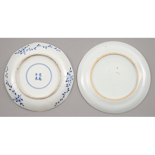 134 - Two Chinese blue and white plates, 18th and 19th c, painted with flowering plants in panelled border... 