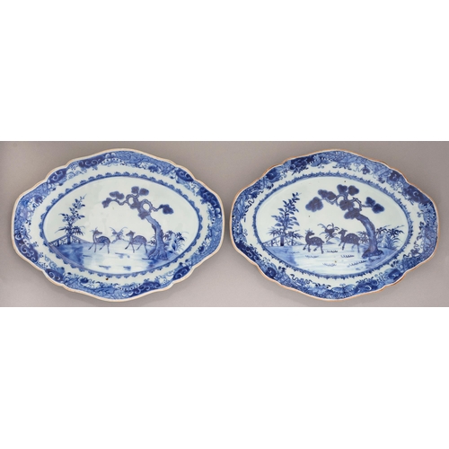 141 - A pair of Chinese blue and white dishes, 18th / early 19th c, painted with an island scene with two ... 