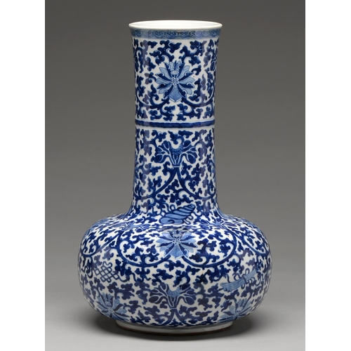 159 - A Chinese blue and white bottle shaped vase, 20th c, painted in Ming style with lotus meander, 40cm ... 