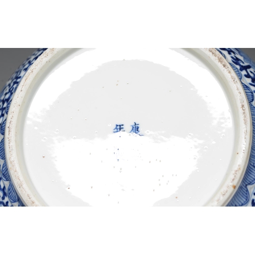 162 - A Chinese blue and white jar and cover, late 19th c or later, painted with lotus and classic scroll,... 