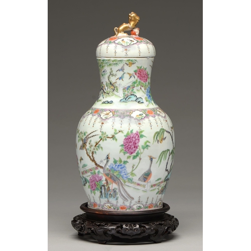 166 - A Chinese Canton famille rose vase and cover, 19th c, enamelled with peafowl and other birds, magnol... 