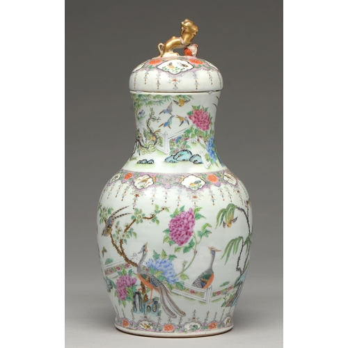 166 - A Chinese Canton famille rose vase and cover, 19th c, enamelled with peafowl and other birds, magnol... 