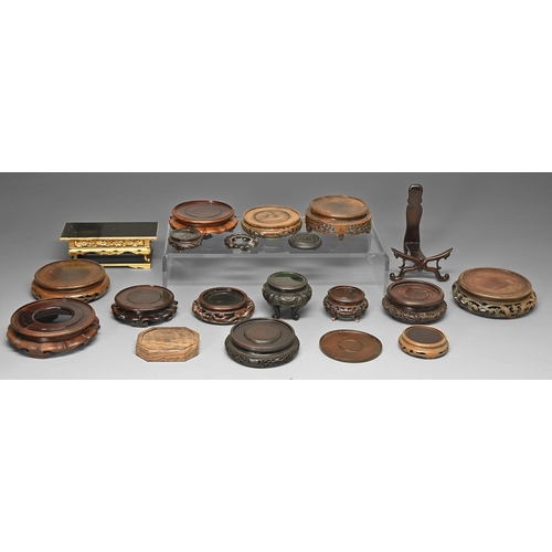 175 - Twenty Chinese and South East Asian wood stands, early 20th c and later, various sizes... 