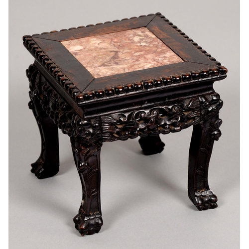 179 - A Chinese hardwood stand, c1900, with stone-inset beaded square top and carved and pierced gallery, ... 