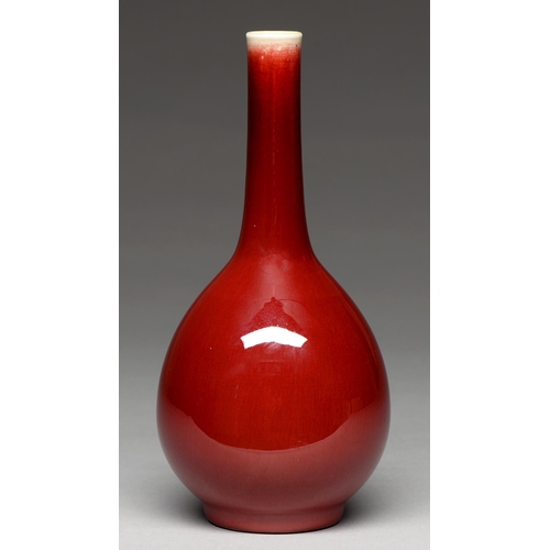 191 - A Chinese flambe glazed vase, 20th c, of slender tapering bulbous form, the even rich glaze thinning... 