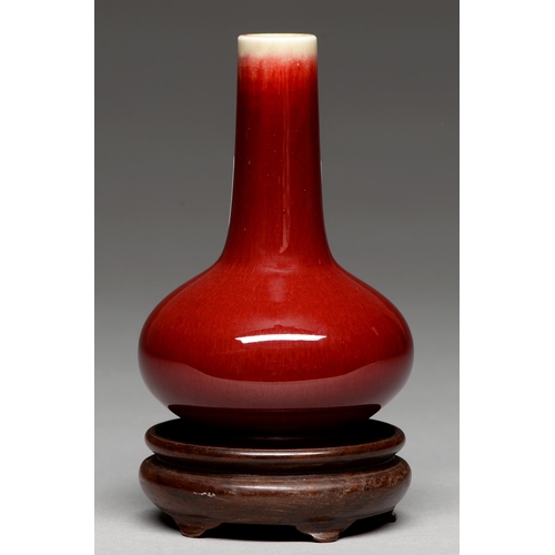 193 - A Chinese flambe glazed vase, 20th c, bottle shaped, the glaze thinning from the neck, 11.5cm h... 