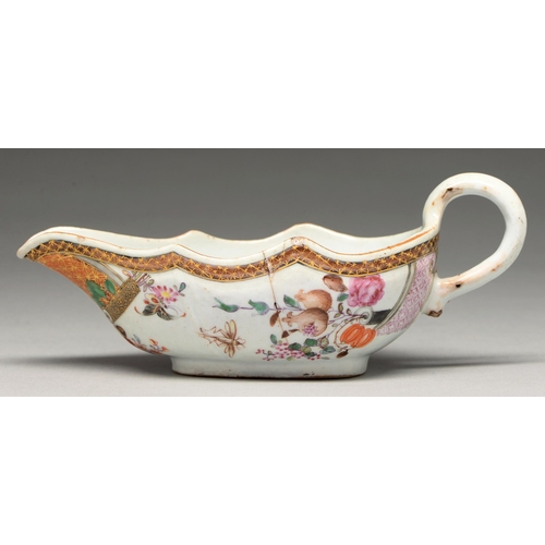 195 - A Chinese famille rose sauce boat, c1760, decorated with flowers and insects, 20cm l... 