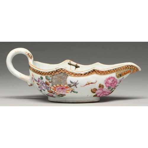 195 - A Chinese famille rose sauce boat, c1760, decorated with flowers and insects, 20cm l... 