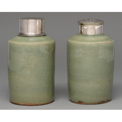 196 - Two Chinese celadon tea caddies, 19th c, the neck unglazed, associated silver coloured metal covers,... 