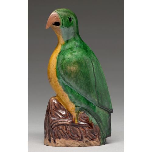 199 - A Chinese glazed biscuit model of a hawk, 19th c, the bird with black eye and glazed in green and oc... 