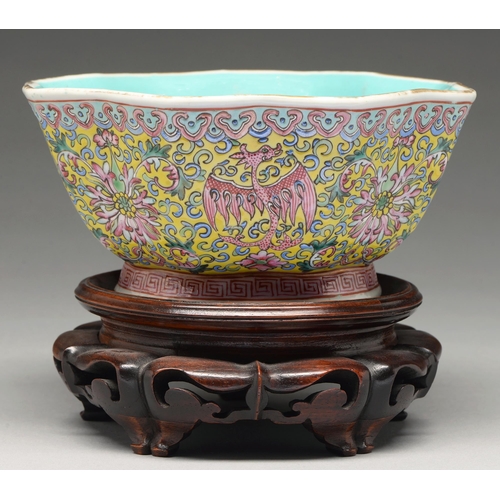 208 - A Chinese yellow ground famille rose bowl, 20th c, enamelled with lotus and phoenix between ruyi and... 