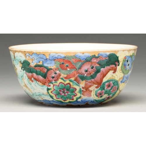 217 - A Chinese porcelain bowl, late 19th c, richly enamelled and gilt with dogs of Fo, a pomegranate to t... 