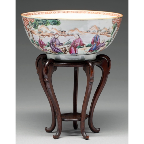 218 - A Chinese famille rose bowl, c1770, painted with two groups of figures by water in a mountainous lan... 