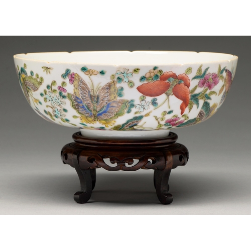 219 - A Chinese famille rose bowl, 20th c, enamelled with butterflies and other insects, lotus and prunus,... 