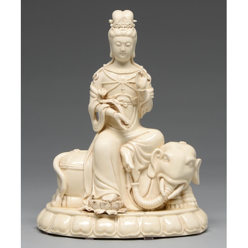 235 - A Chinese blanc de chine figure of Guanyin on an elephant, 20th c, 32cm h