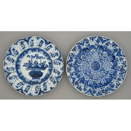 237 - Two Chinese blue and white plates, Kangxi period, painted with a flower filled basket or formal flor... 