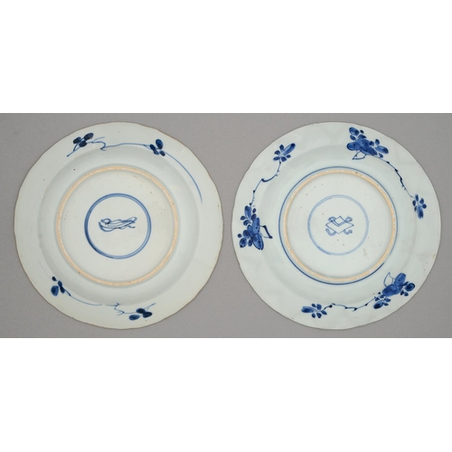 237 - Two Chinese blue and white plates, Kangxi period, painted with a flower filled basket or formal flor... 