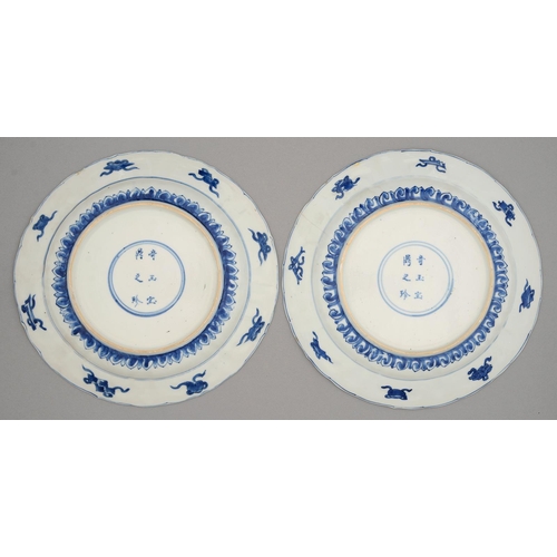 240 - Two Chinese blue and white dishes, Kangxi period, painted with lotus or flowers, the border of lotus... 