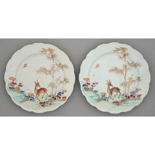 243 - A pair of Chinese famille rose plates, 18th c, enamelled with deer, bamboo and sacred fungus, 23cm d... 