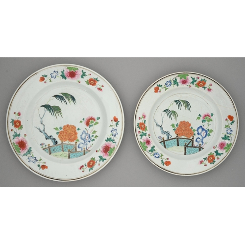 254 - A graduated pair of Chinese famille rose dishes, 18th c, painted with peonies, willow and turquoise ... 