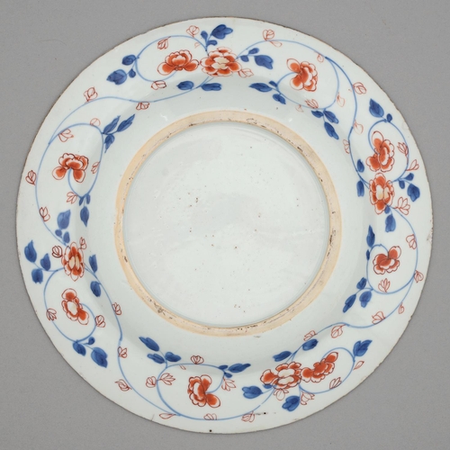 255 - A Chinese Imari plate, 18th c, painted with three clumps of flowering plants bordered by trailing fl... 